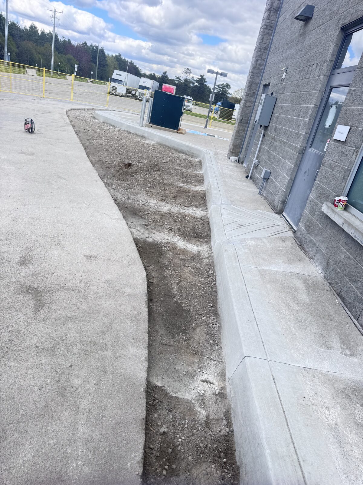 New concrete curb and sidewalk construction at a commercial property