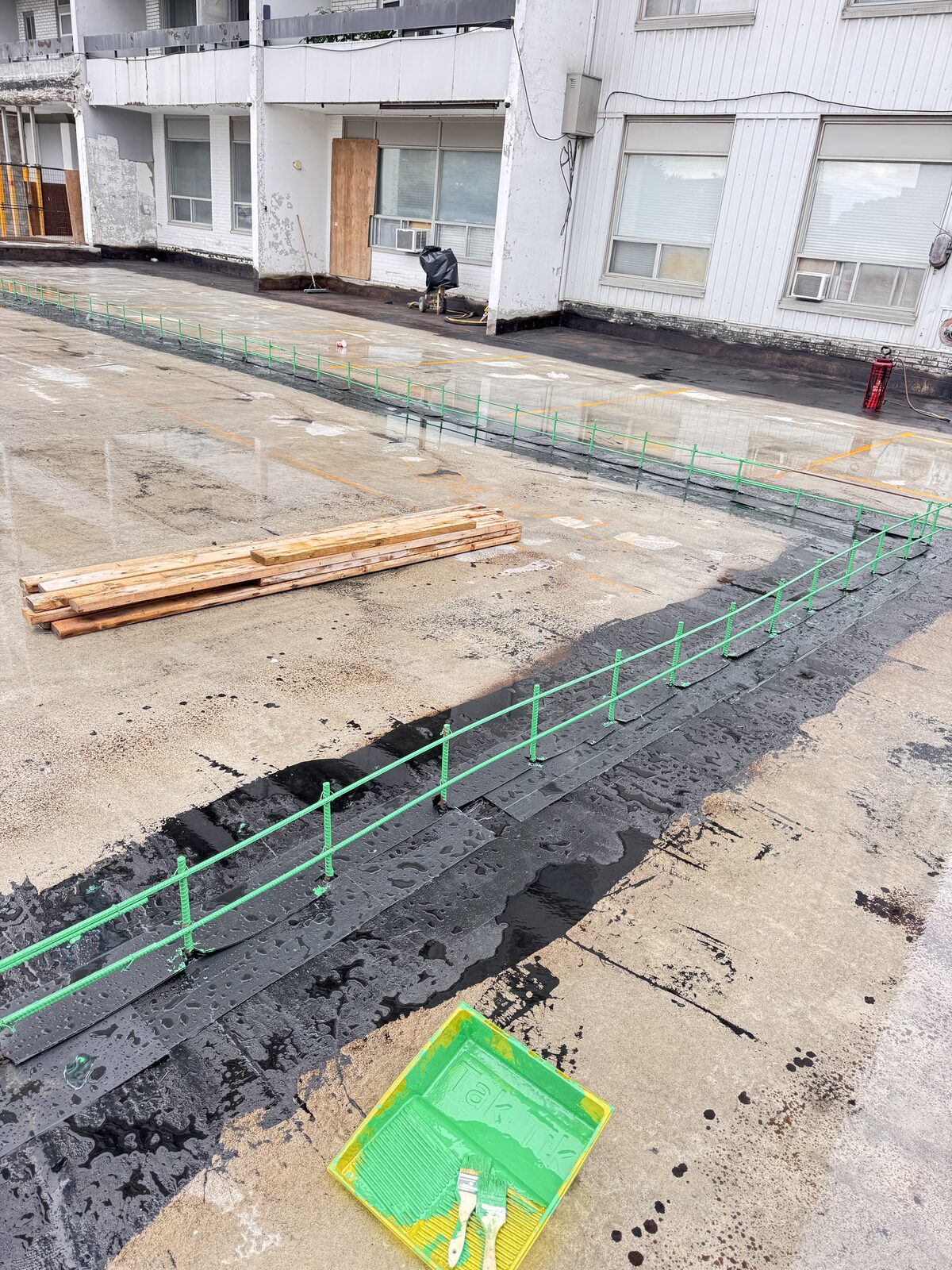 Concrete formwork and rebar installation for commercial building foundation.