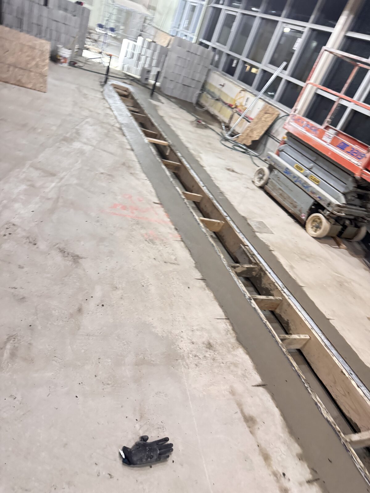 Concrete trench pour with wooden formwork and rebar onsite