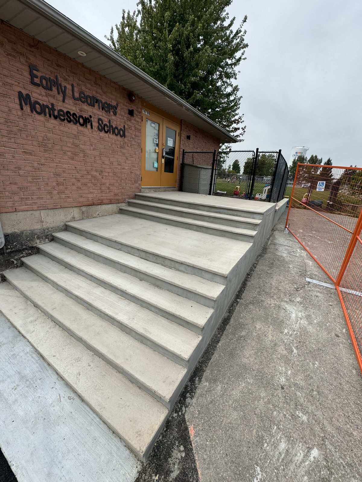 New concrete stairs and ramp leading to Early Learners Montessori School entrance