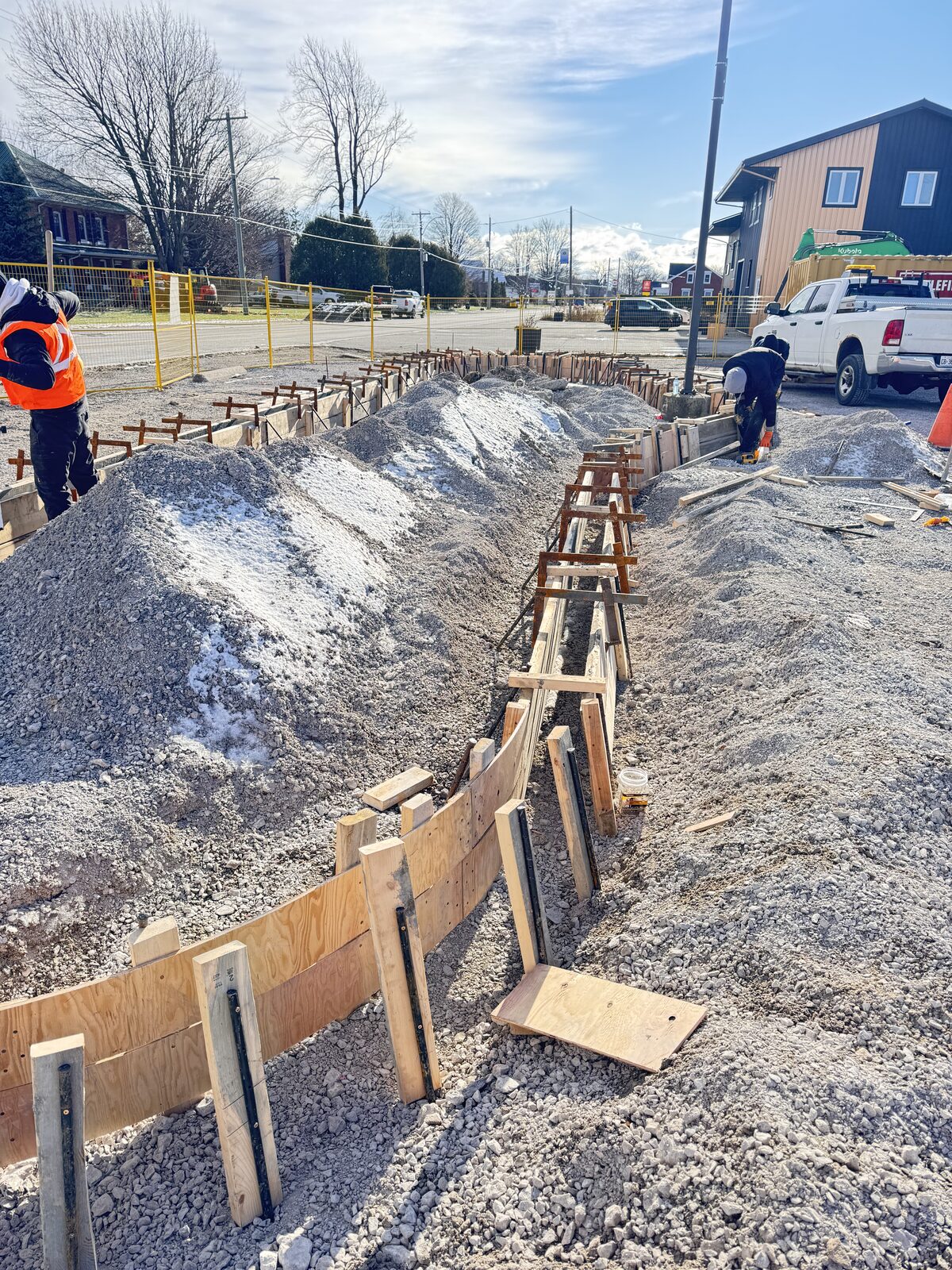 Concrete foundation forms and rebar setup for new construction project.